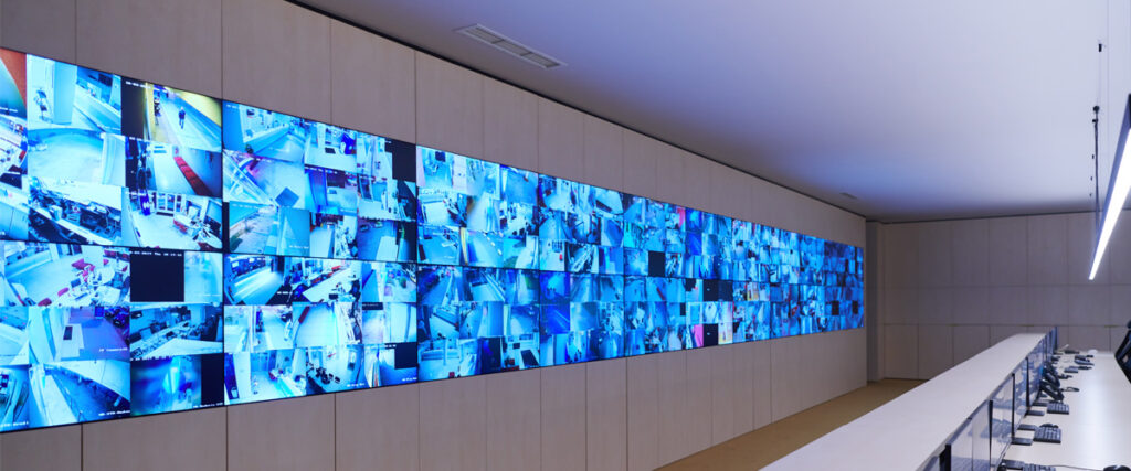 Wall-mounted commercial TV displays in a modern business interior