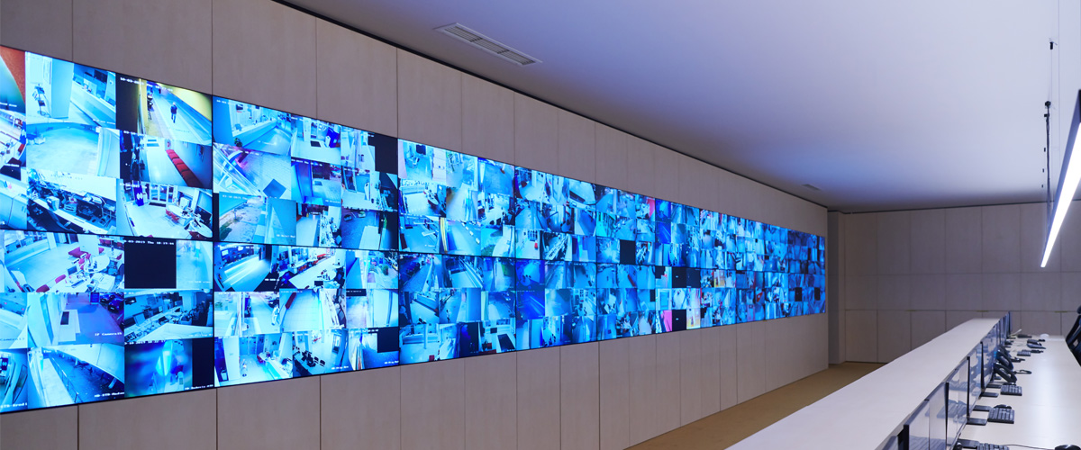 Wall-mounted commercial TV displays in a modern business interior