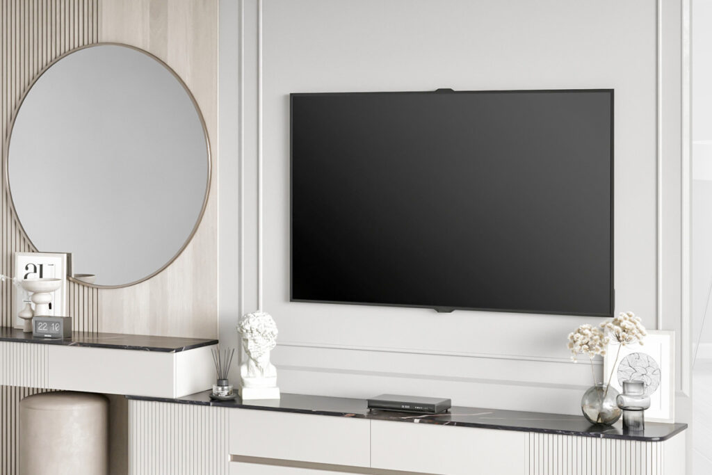 Wall-mounted flat screen TV with hidden wires in a modern living room