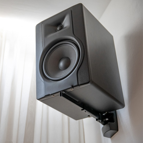 Wall-mounted speaker in a modern living room setup