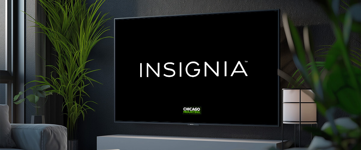 Insignia TV and soundbar mounted on a living room wall by Chicago Mounting.