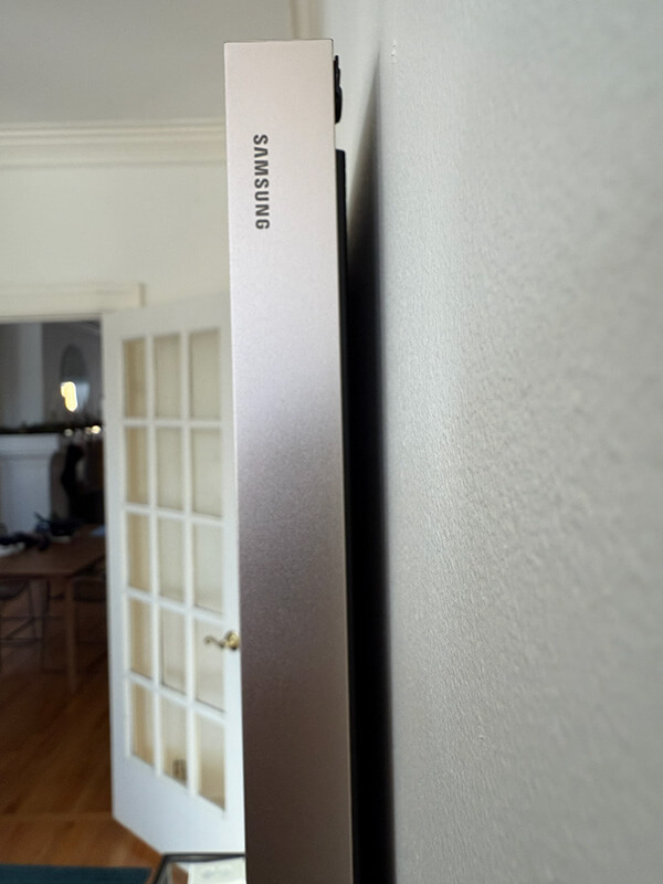 Samsung Frame TV mounted flush against the wall with an ultra-slim, gap-free profile