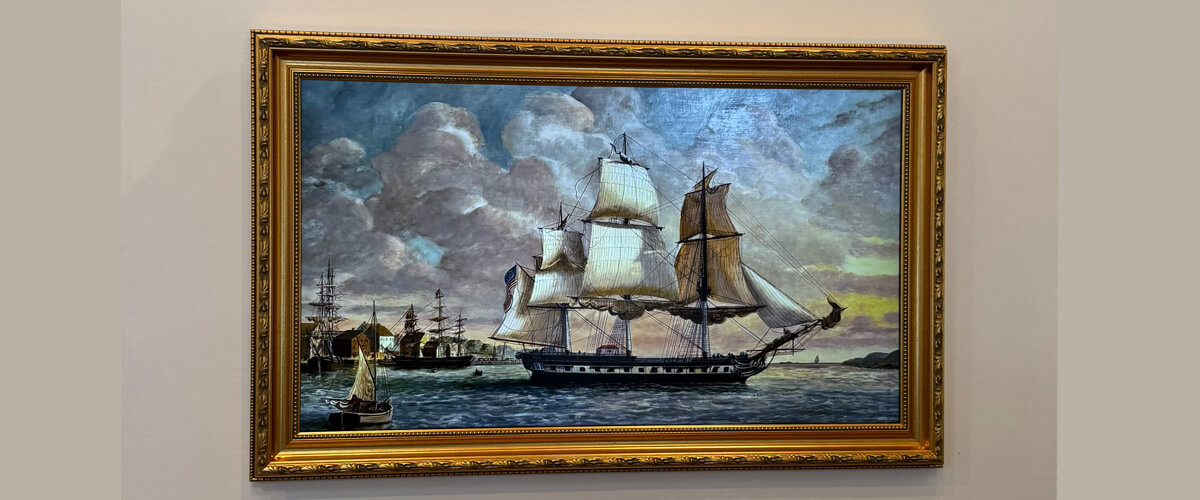 Samsung Frame TV mounted on the wall, displaying artwork like a framed picture